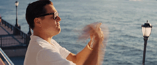 wold of wall street throw money away gif