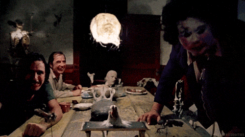 the texas chainsaw massacre dinner scene gif